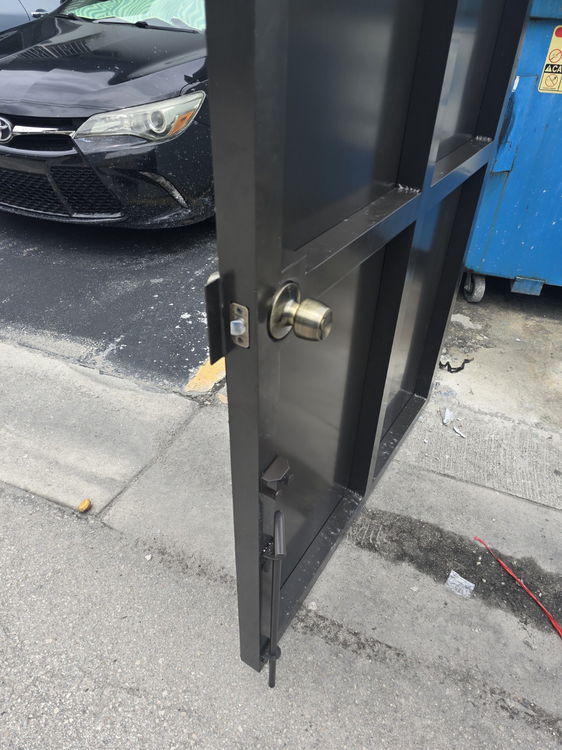 Lock and gate hardware detail on the completed enclosure